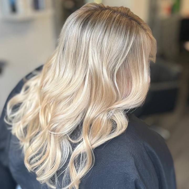 Soft blonde highlights with natural waves created by stylist Alina Kalinichenko in Ryde