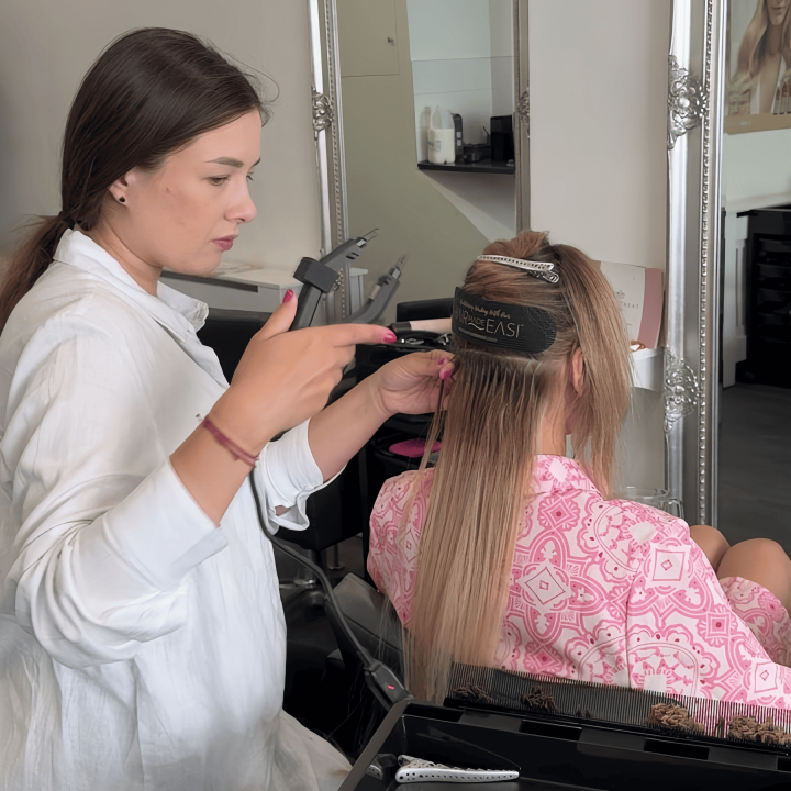 Alina Kalinichenko preparing to apply keratin bond hair extensions in Ryde