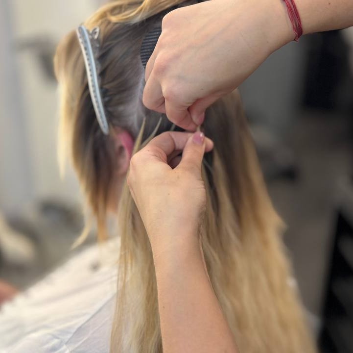 Hand-placement of hair extension strands for even distribution – Alina Kalinichenko | Ryde Isle of Wight Hair Stylist
